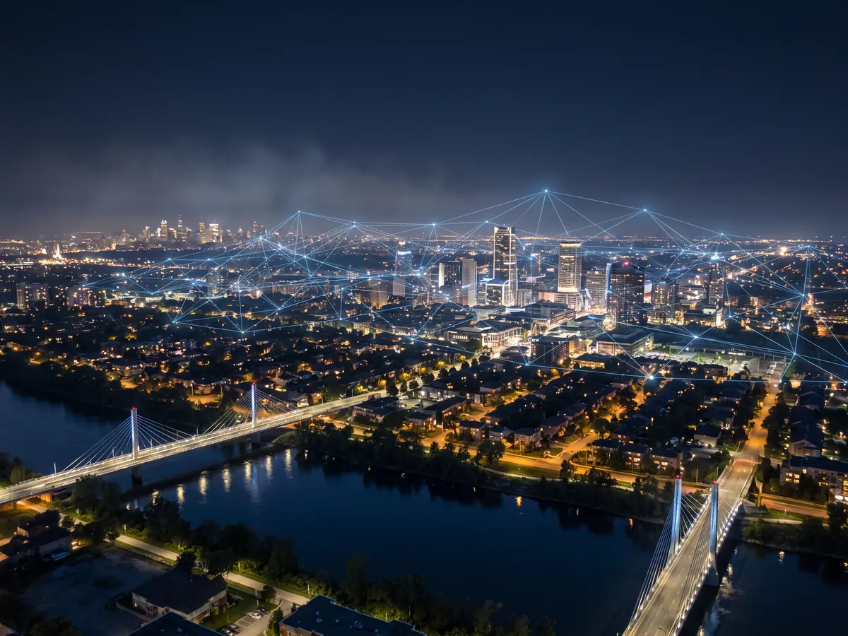 Illustration: Laval at night, a network of light above its businesses