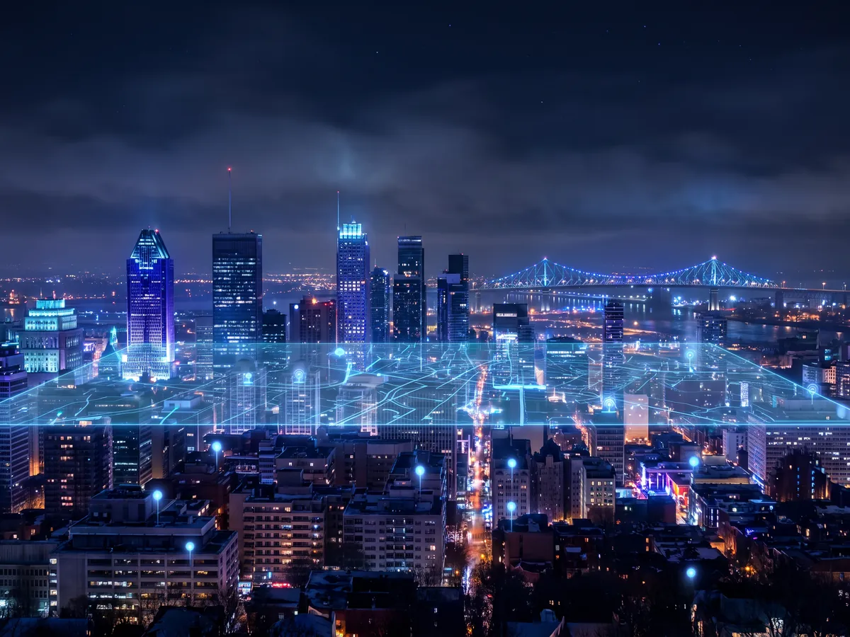 Illustration: Montréal at night, a network of light above its businesses
